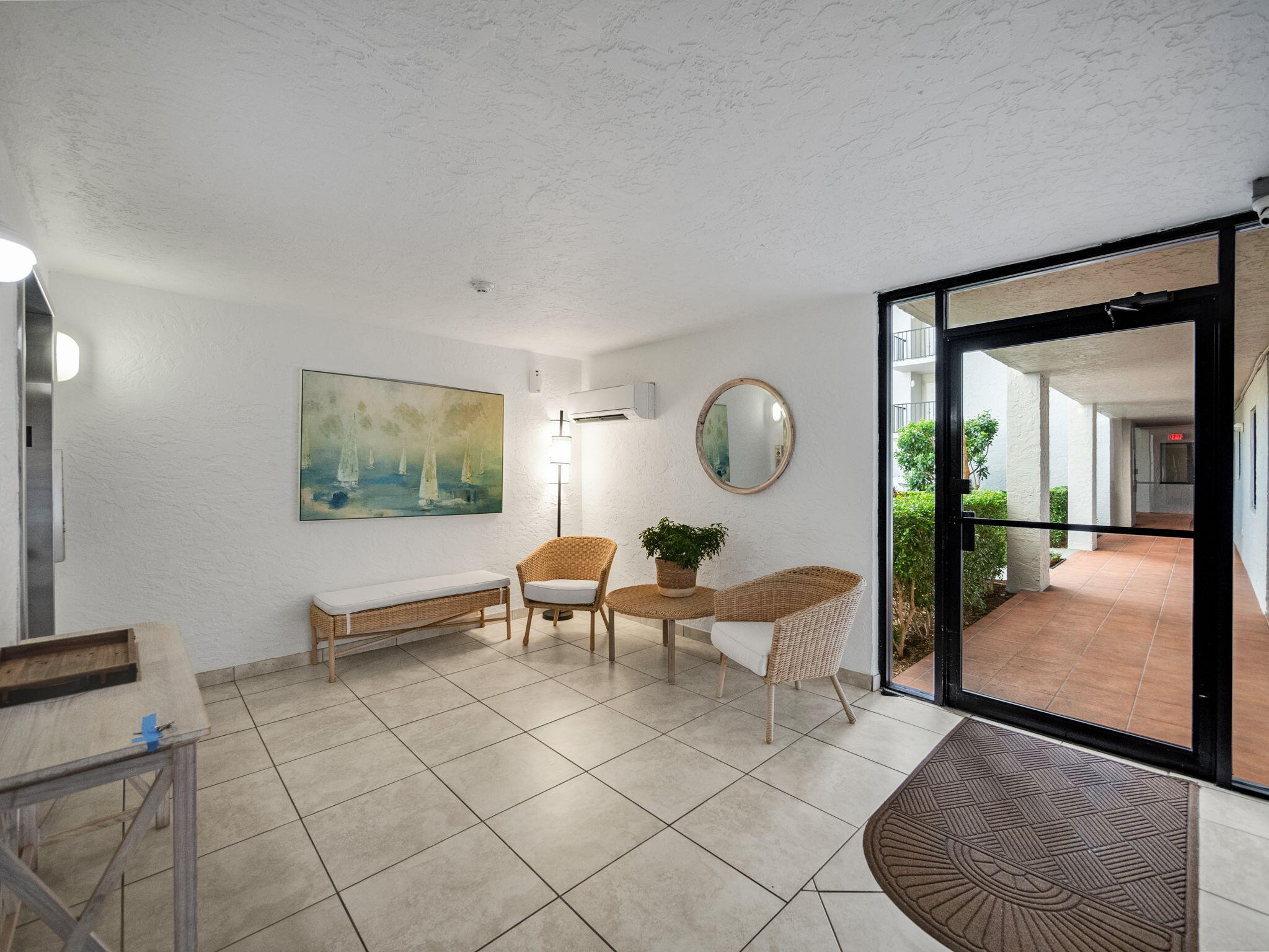 3525 South Ocean Boulevard, Unit 107 South Palm Beach, FL 33480 - Photo 4 of 21 a living room with furniture and a large window