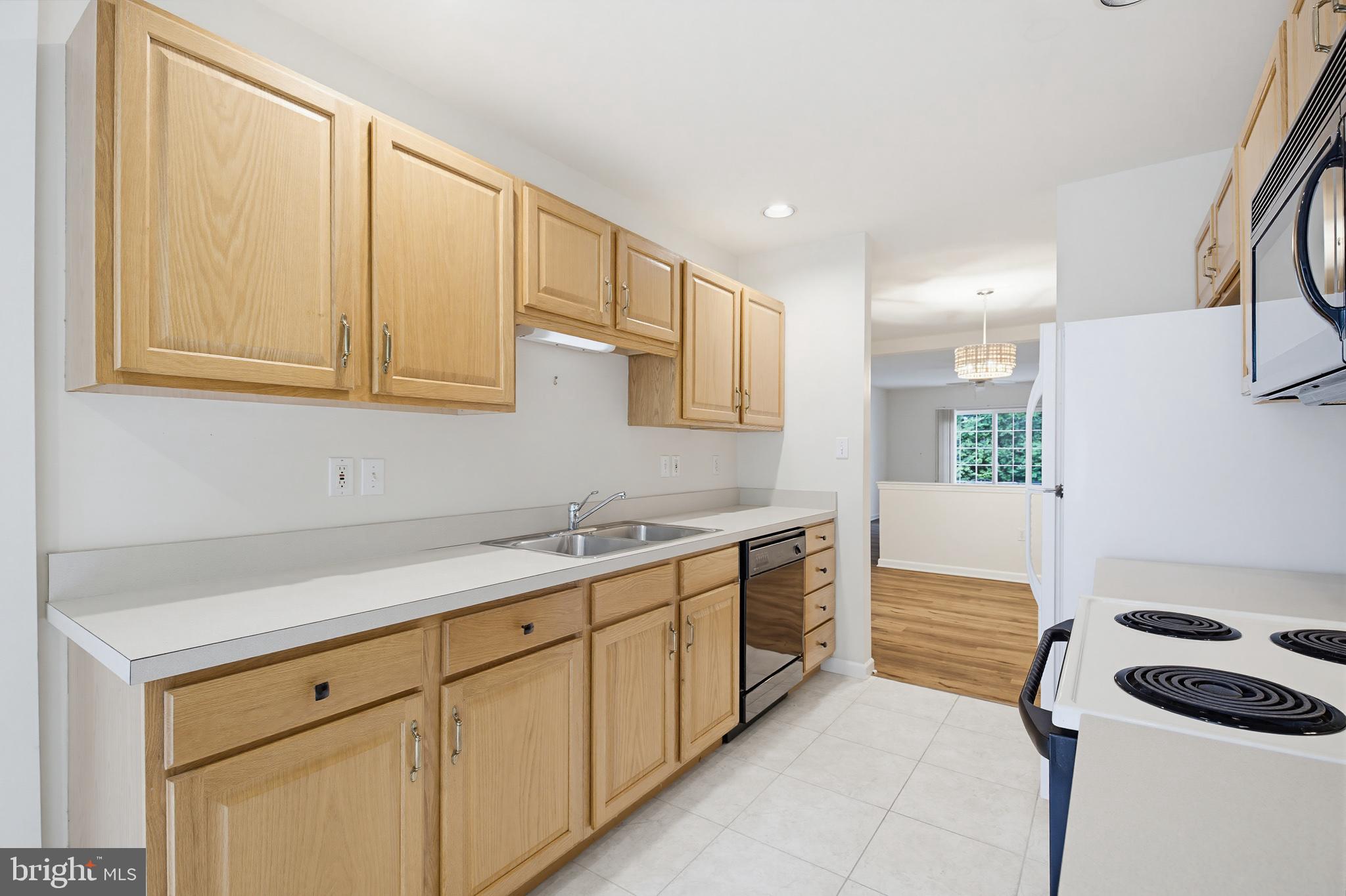 1037 Kent Garden Lititz, PA 17543 - Photo 19 of 31 a kitchen with stainless steel appliances granite countertop a sink and a stove