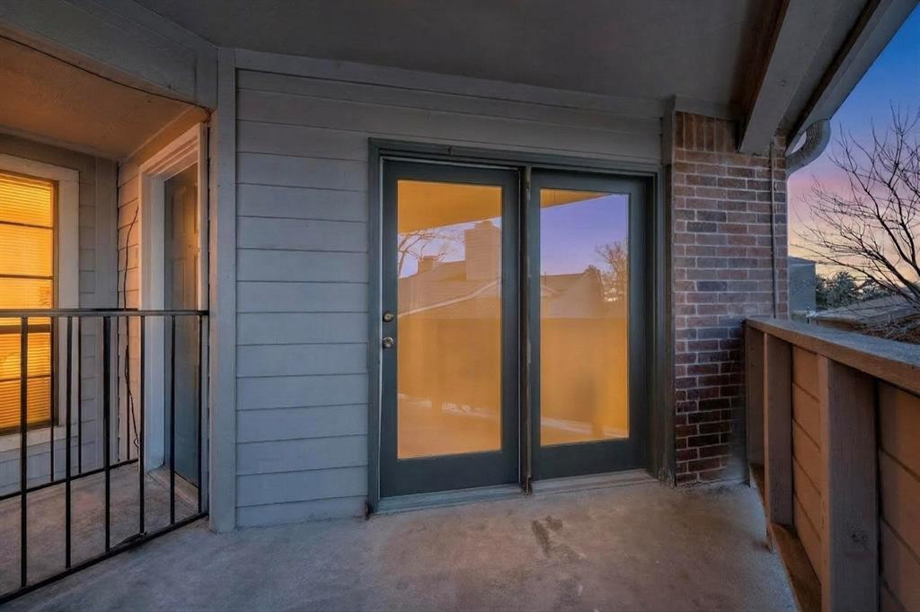8545 Midpark Road, Unit 16 Dallas, TX 75240 - Photo 27 of 29 Property entrance with brick siding