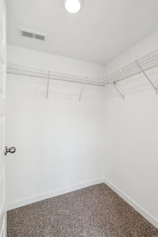 a view of a room with racks on the wall