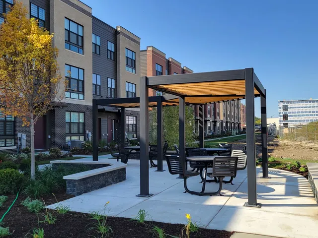 a patio with table and chairs