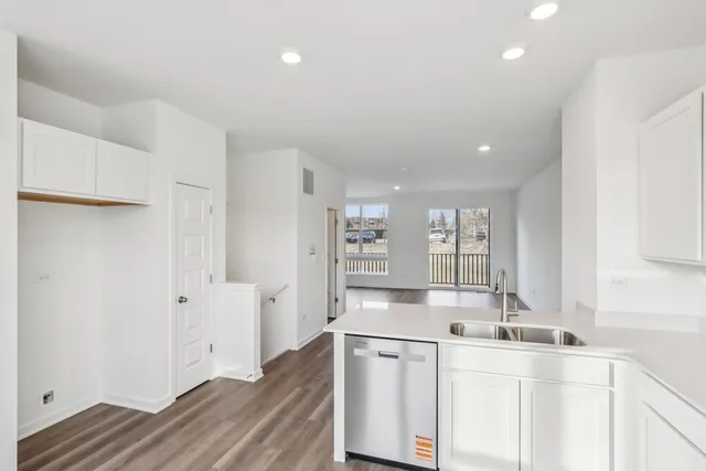 a kitchen with stainless steel appliances granite countertop a sink and cabinets