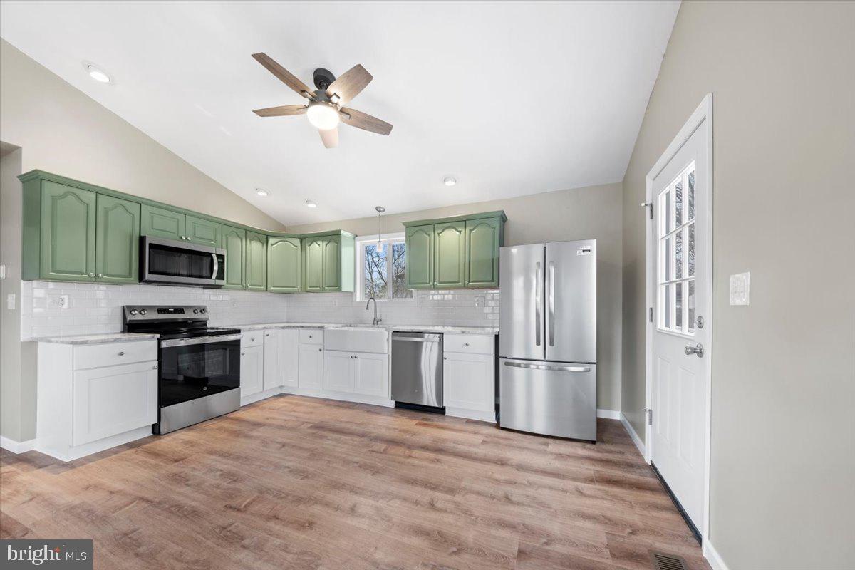 308 Apache Trail Browns Mills, NJ 08015 - Photo 12 of 34 a kitchen with stainless steel appliances kitchen island granite countertop a refrigerator a stove top oven a sink and dishwasher