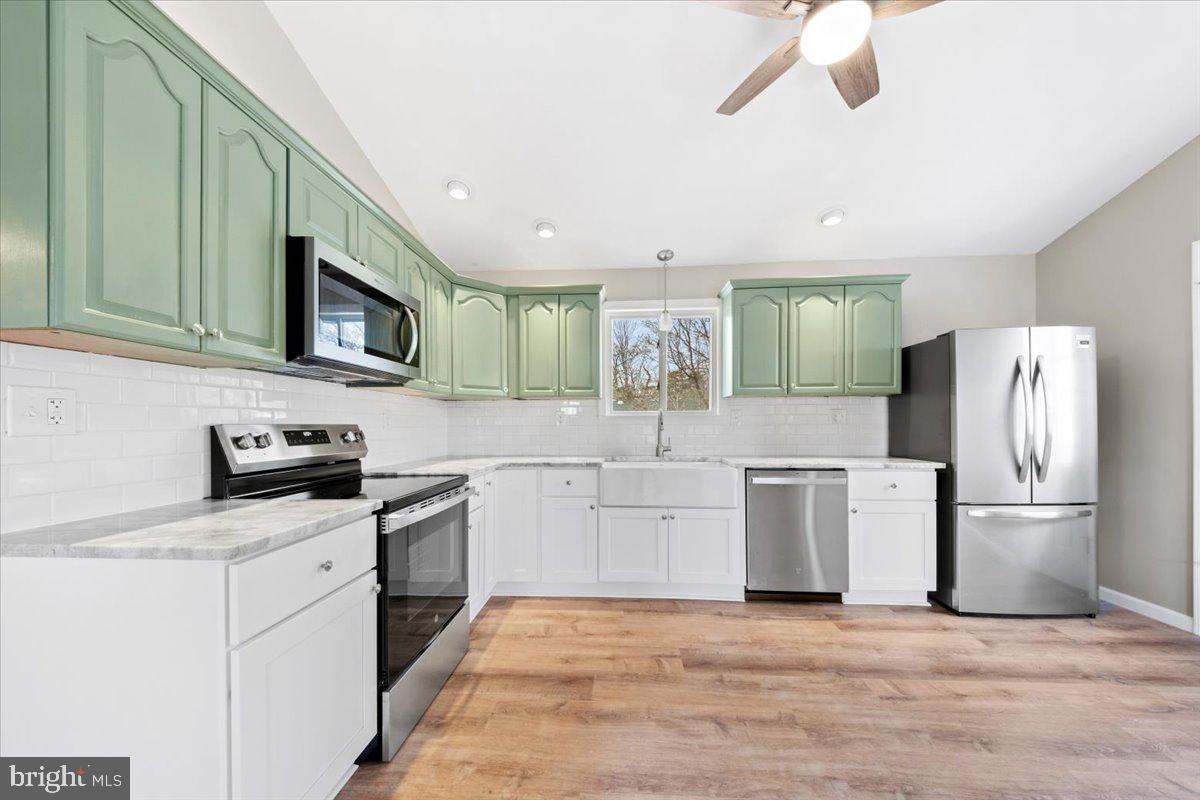308 Apache Trail Browns Mills, NJ 08015 - Photo 13 of 34 a kitchen with a refrigerator sink and cabinets