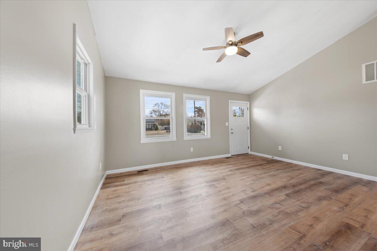 308 Apache Trail Browns Mills, NJ 08015 - Photo 19 of 34 an empty room with window and ceiling fan