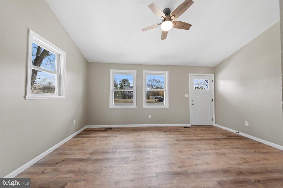 308 Apache Trail Browns Mills, NJ 08015 - Photo 20 of 34 a view of empty room with wooden floor and fan