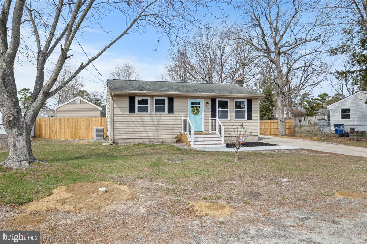 308 Apache Trail Browns Mills, NJ 08015 - Photo 2 of 34 a house that has a tree in front of it