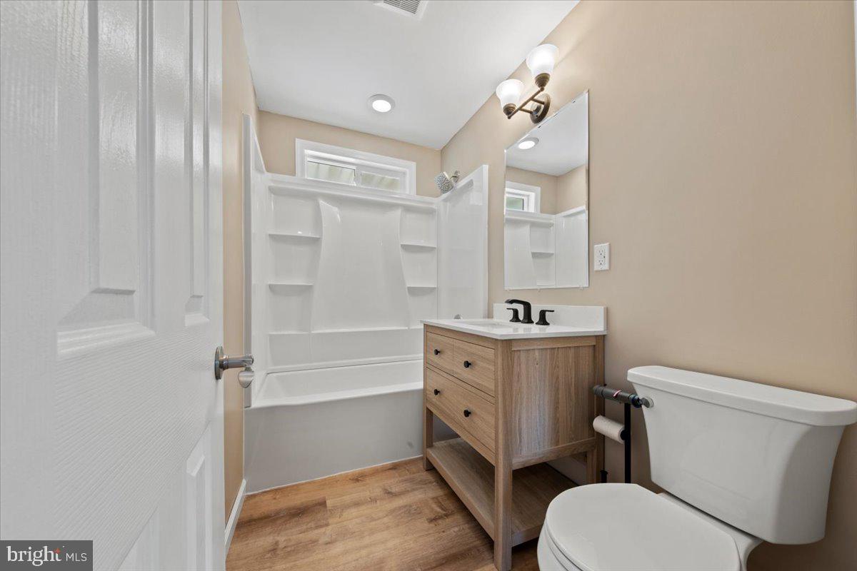 308 Apache Trail Browns Mills, NJ 08015 - Photo 24 of 34 a bathroom with a sink a toilet a mirror and shower
