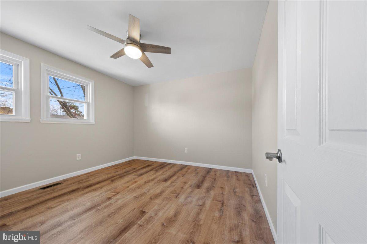 308 Apache Trail Browns Mills, NJ 08015 - Photo 25 of 34 wooden floor in an empty room with a window