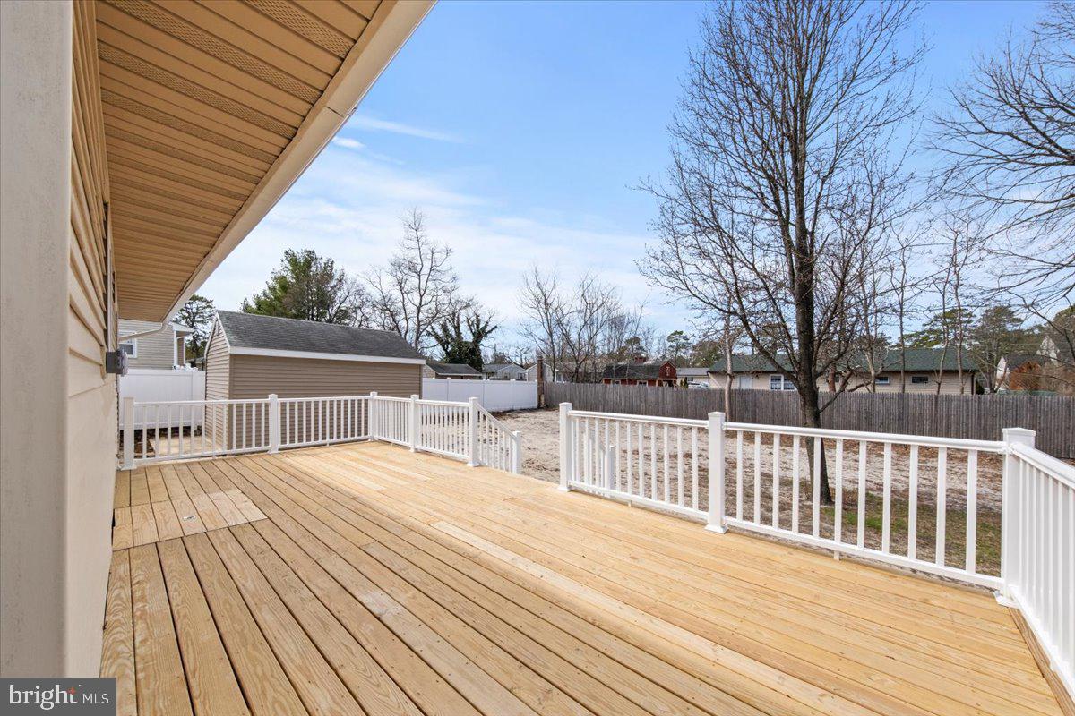 308 Apache Trail Browns Mills, NJ 08015 - Photo 28 of 34 a view of backyard with a deck and wooden floor