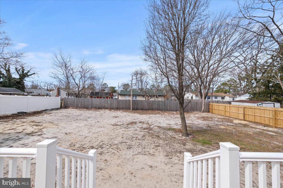 308 Apache Trail Browns Mills, NJ 08015 - Photo 30 of 34 a backyard of a house with large trees