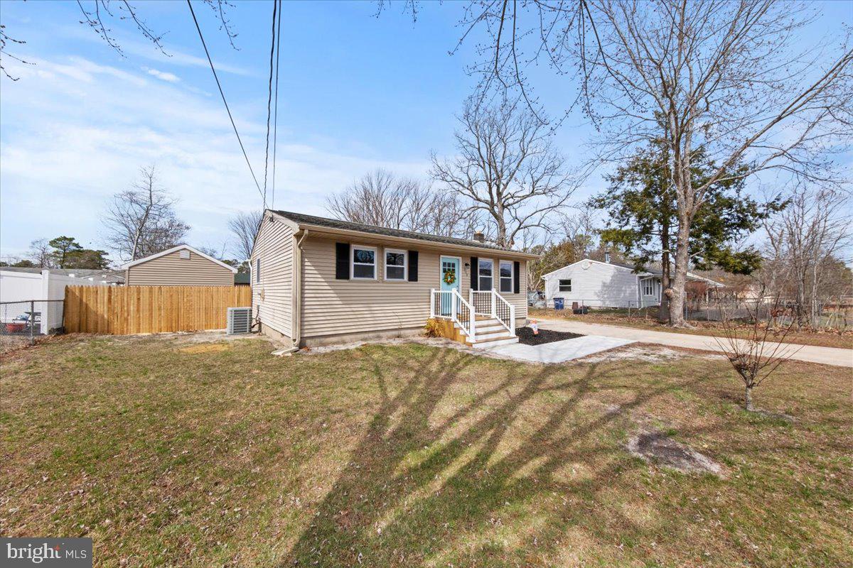 308 Apache Trail Browns Mills, NJ 08015 - Photo 4 of 34 a view of a house with snow on the road