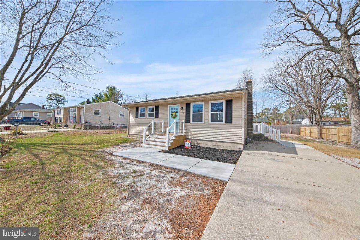 308 Apache Trail Browns Mills, NJ 08015 - Photo 7 of 34 a view of a house with snow on the side of the road