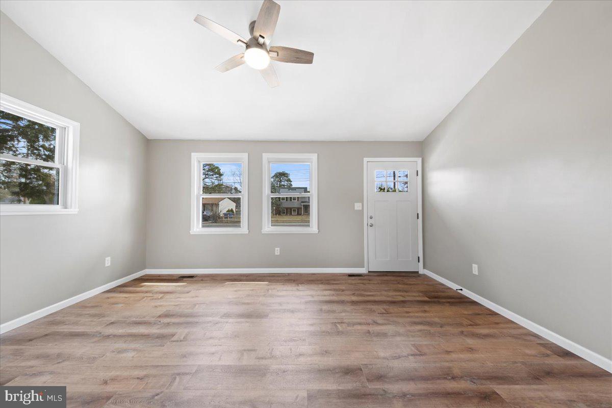 308 Apache Trail Browns Mills, NJ 08015 - Photo 8 of 34 wooden floor in an empty room with a window
