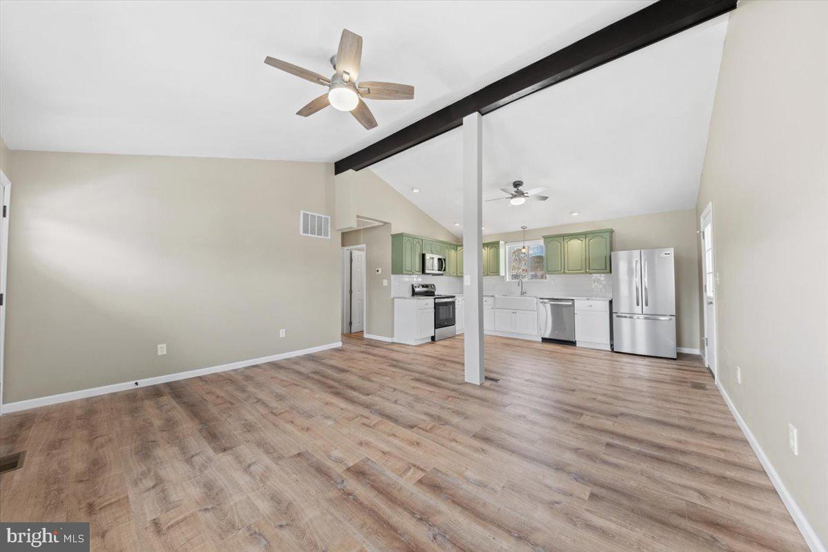 308 Apache Trail Browns Mills, NJ 08015 - Photo 10 of 34 a view of a livingroom with wooden floor and a ceiling fan