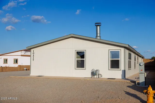 a view of a house with a street