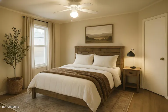 a bedroom with a bed and a window