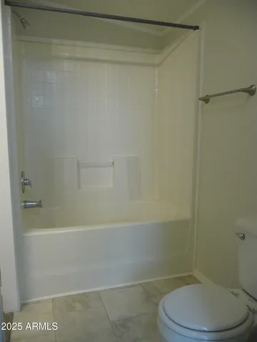 a view of a workspace with furniture and wooden floor