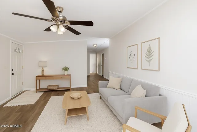 an empty room with fan and entrance