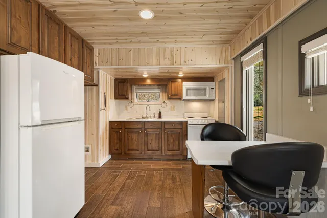 a kitchen with a refrigerator a sink and a stove