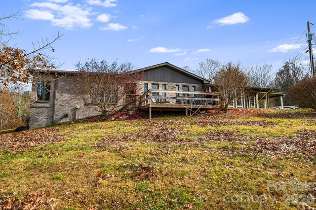a house with swimming pool in front of it