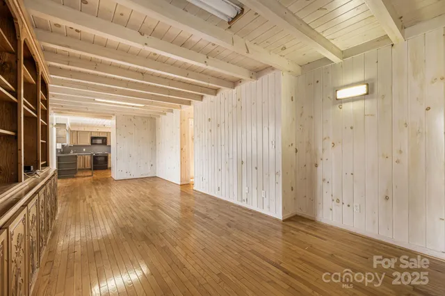 a view of a livingroom with wooden floor