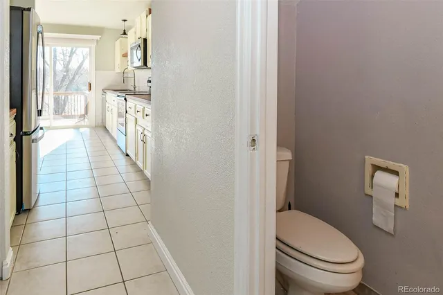 a bathroom with a granite countertop sink a mirror and a shower