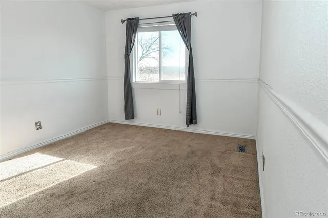 a view of a yard from a lake