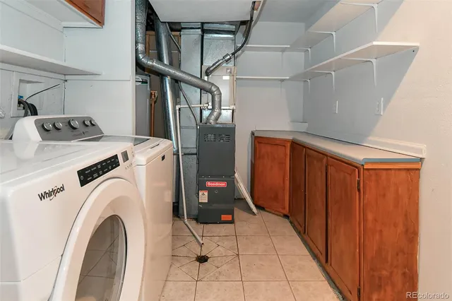 a bathroom with a sink a toilet a mirror and shower