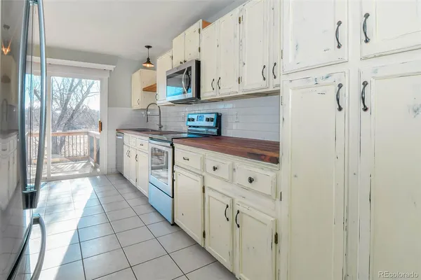 a view of a kitchen from the hallway