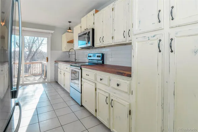 a view of a kitchen from the hallway