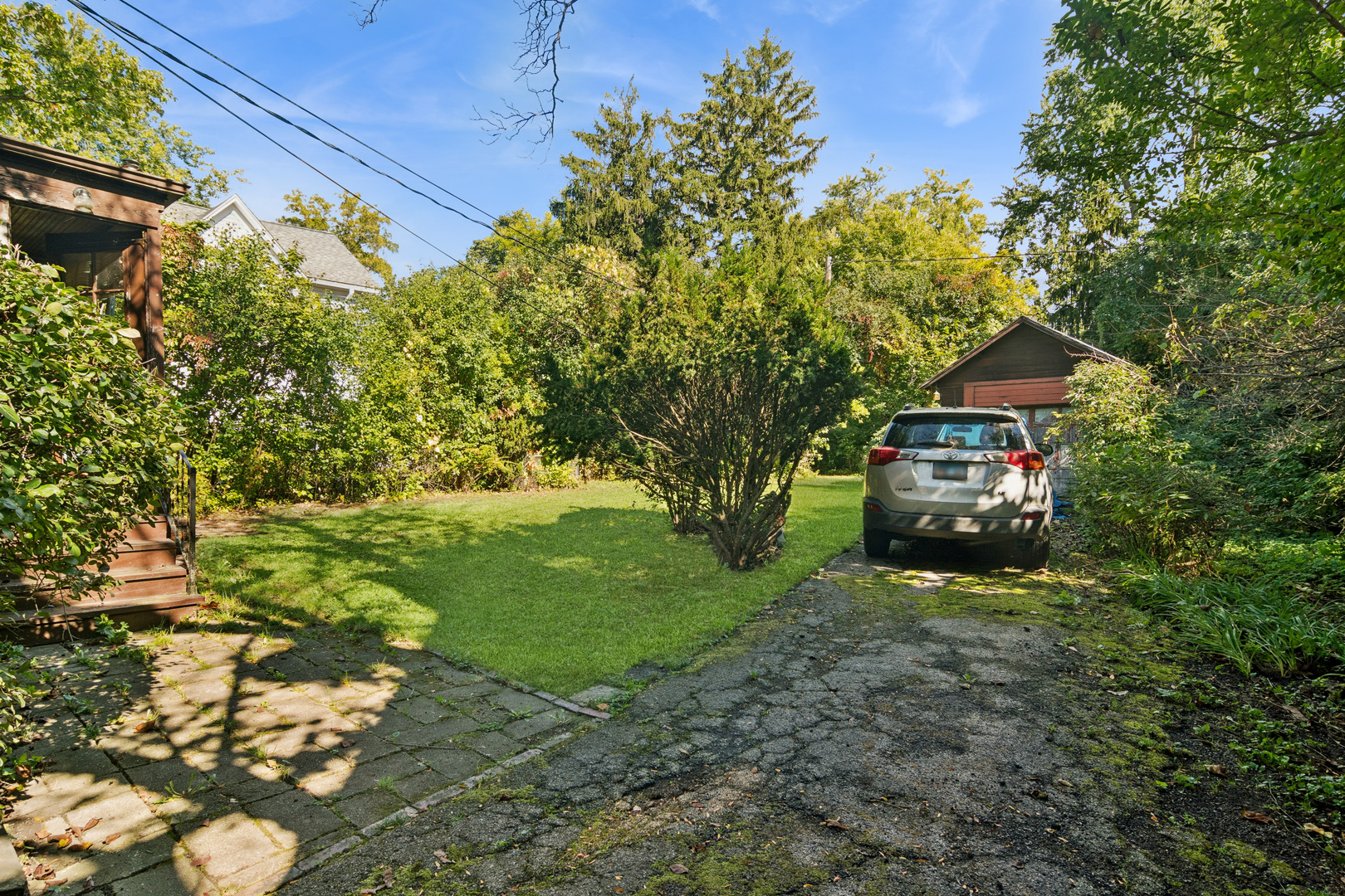 785 Locust Street Winnetka, IL 60093 - Photo 15 of 19 a yellow house with trees in the background