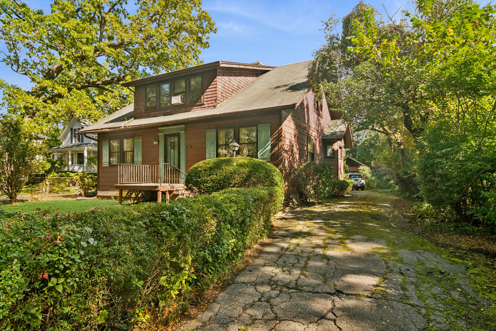 785 Locust Street Winnetka, IL 60093 - Photo 2 of 19 a front view of a house with garden