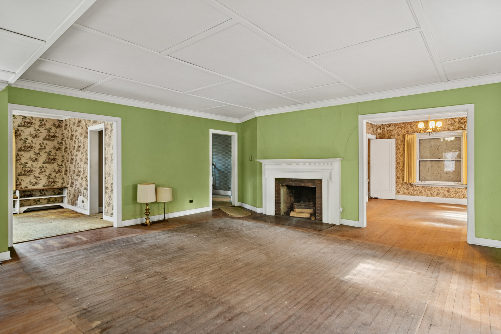 785 Locust Street Winnetka, IL 60093 - Photo 4 of 19 a view of an empty room with a fireplace and a window