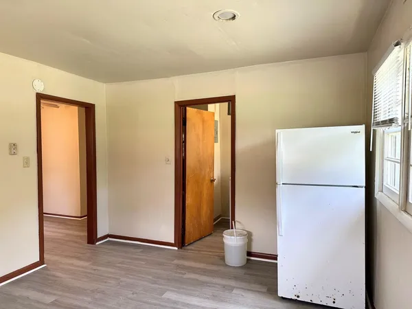 a white refrigerator freezer sitting in a kitchen