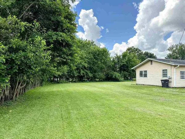 a view of a backyard of the house