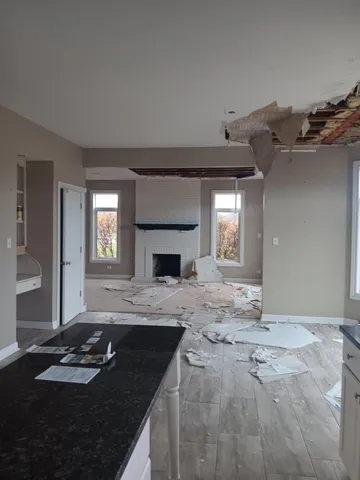 a view of empty room with a fireplace