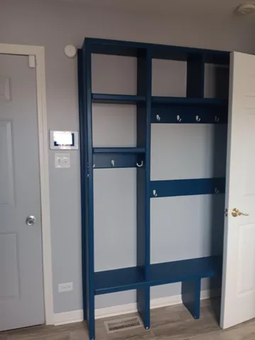 a utility room with cabinets washer and dryer
