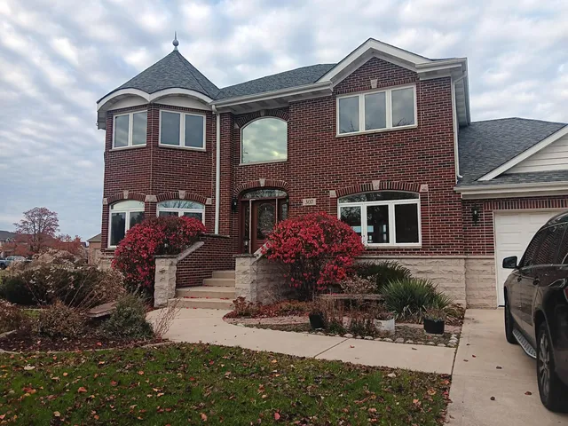 a front view of a house with a yard