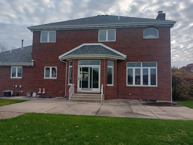 a view of a house with a small yard