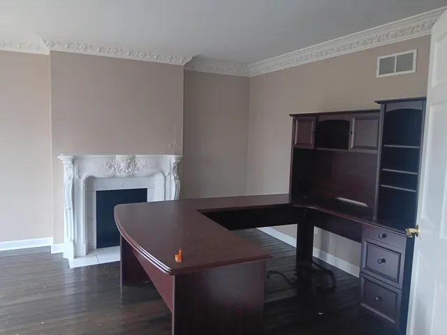 a view of wooden floor and windows in a room