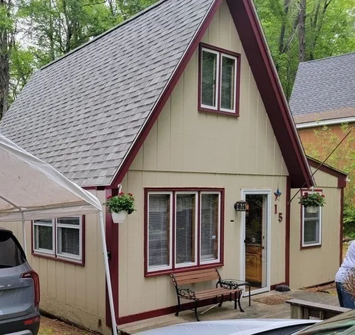 a view of a backyard with a small cabin