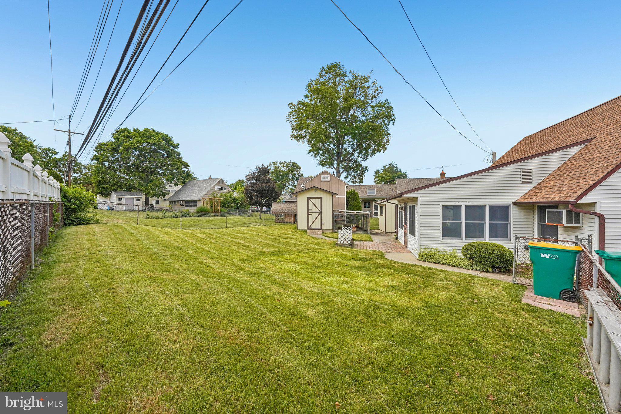 9 Rustleaf Lane Levittown, PA 19055 - Photo 6 of 45 Spacious backyard with lush greenery.