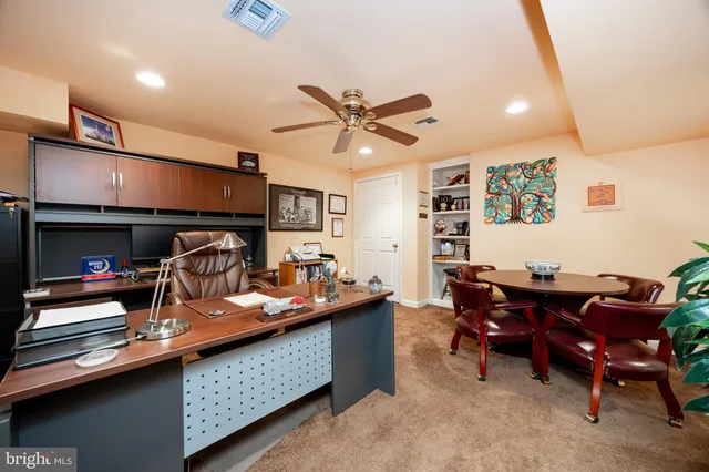 a view of a workspace with furniture