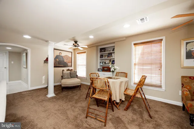 a dining room with furniture and window