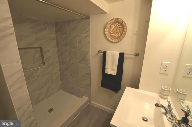 a bathroom with a tub and a shower