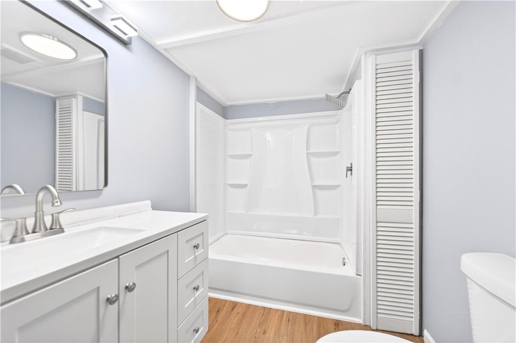93 Old 51 Road Perryopolis, PA 15473 - Photo 35 of 44 a bathroom with a sink a toilet a vanity and shower