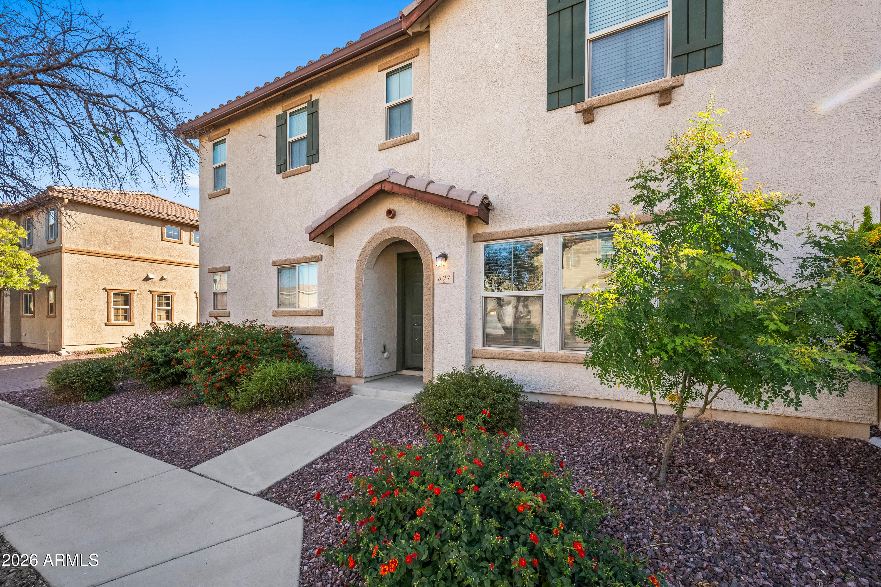 507 North Ranger Trail Gilbert, AZ 85234 - Photo 1 of 19 a front view of a house with garden
