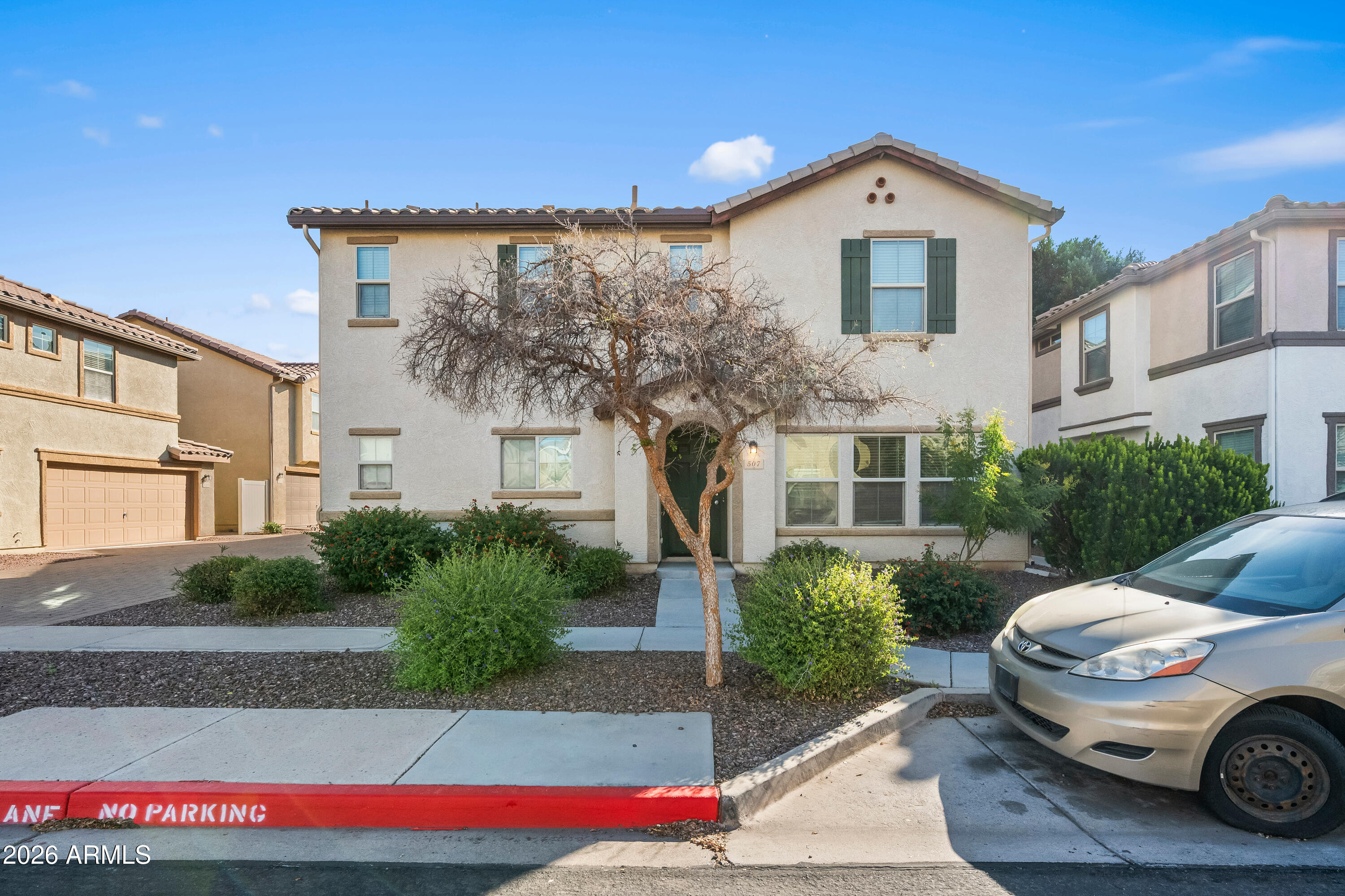 507 North Ranger Trail Gilbert, AZ 85234 - Photo 2 of 19 a front view of a house with garden