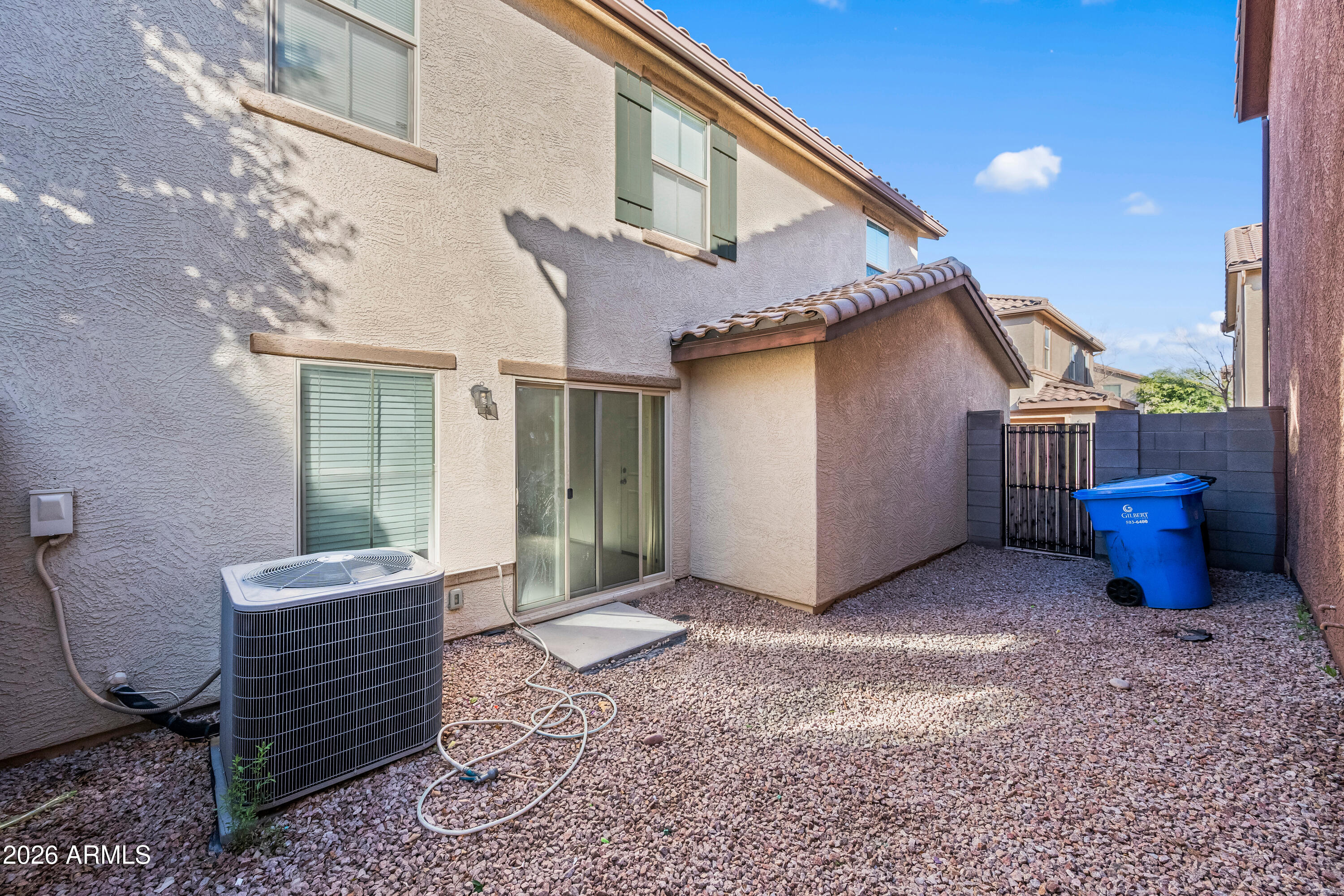 507 North Ranger Trail Gilbert, AZ 85234 - Photo 4 of 19 a view of a chair and fire pit in backyard of the house